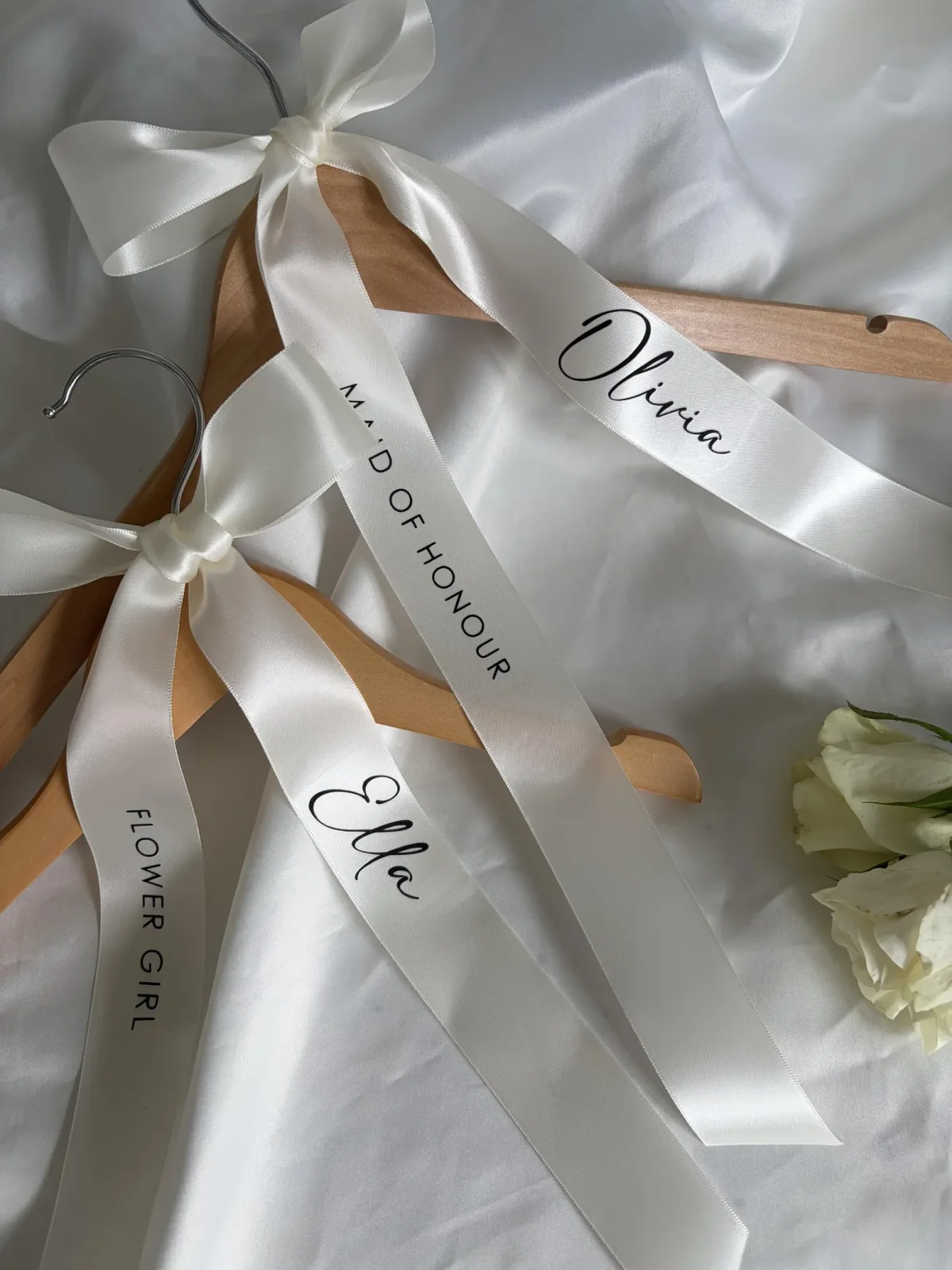 White satin ribbon with bridesmaid and maid of honor personalized that tie onto wedding hangers
