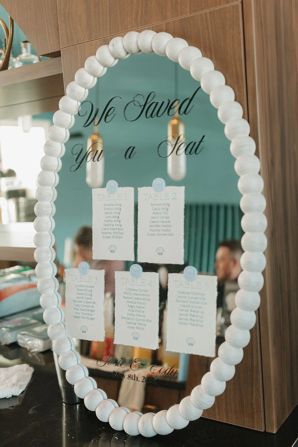 White beaded mirror for beach wedding seating chart personalized with Cricut vinyl and Cricut pens