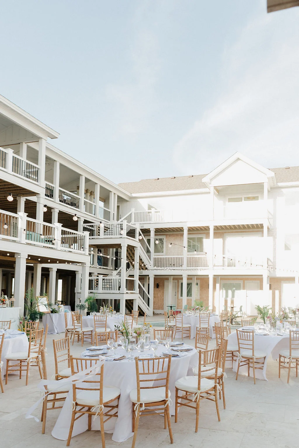 Outdoor patio wedding reception at Hill Runner at Penny's Hill Beach Club