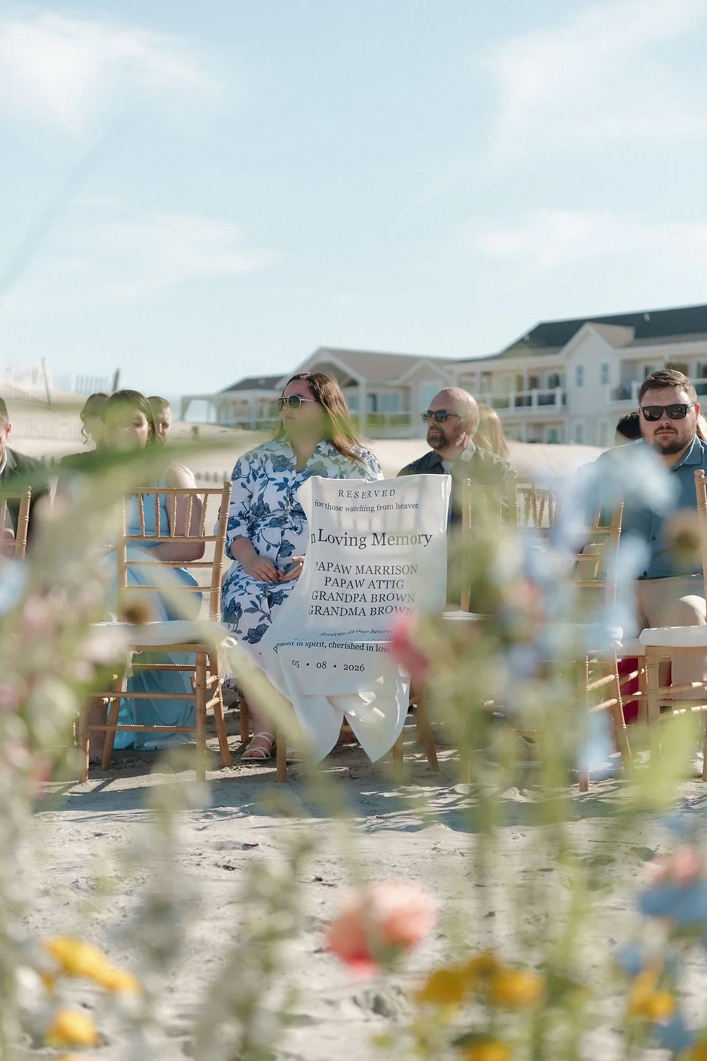 In Loving Memory memorial chair fabric sign made with a Cricut machine for a beach wedding ceremony