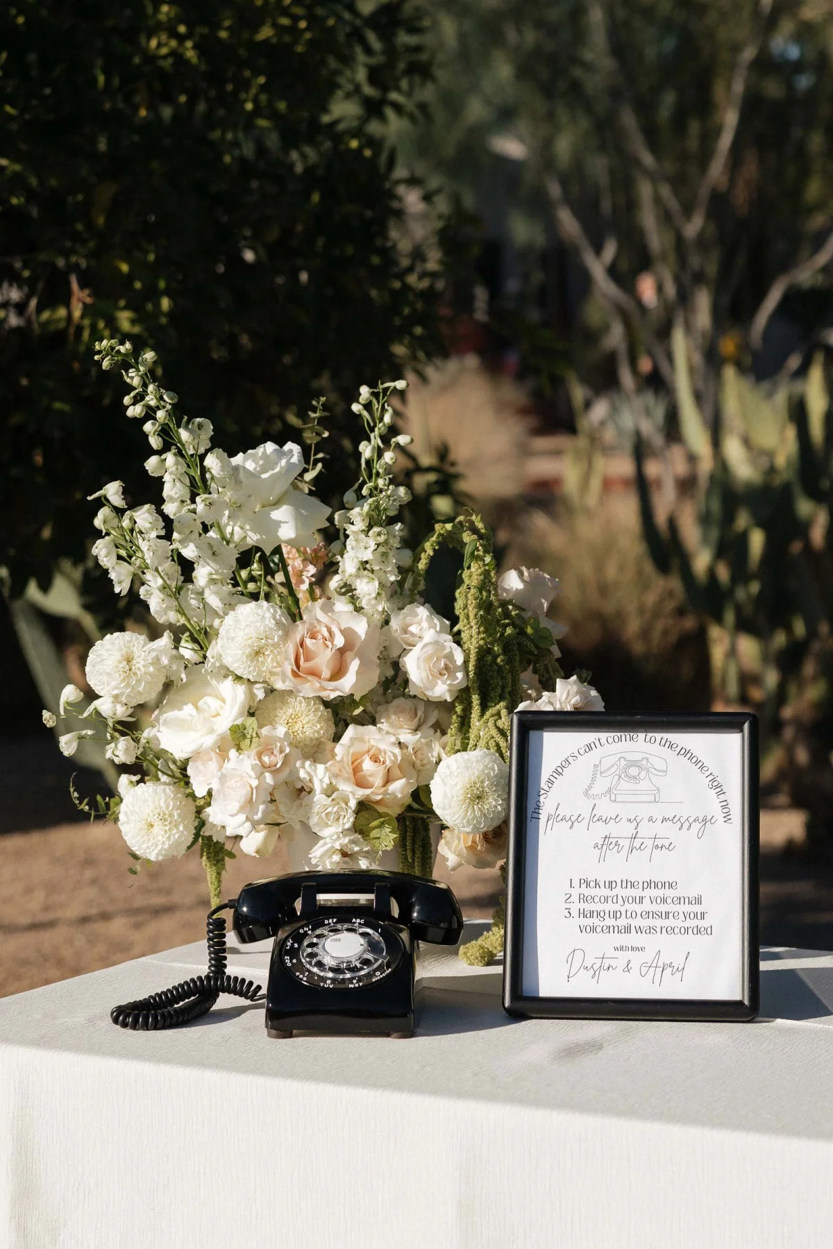 Modern black retro rotary phone for a wedding audio guestbook setup