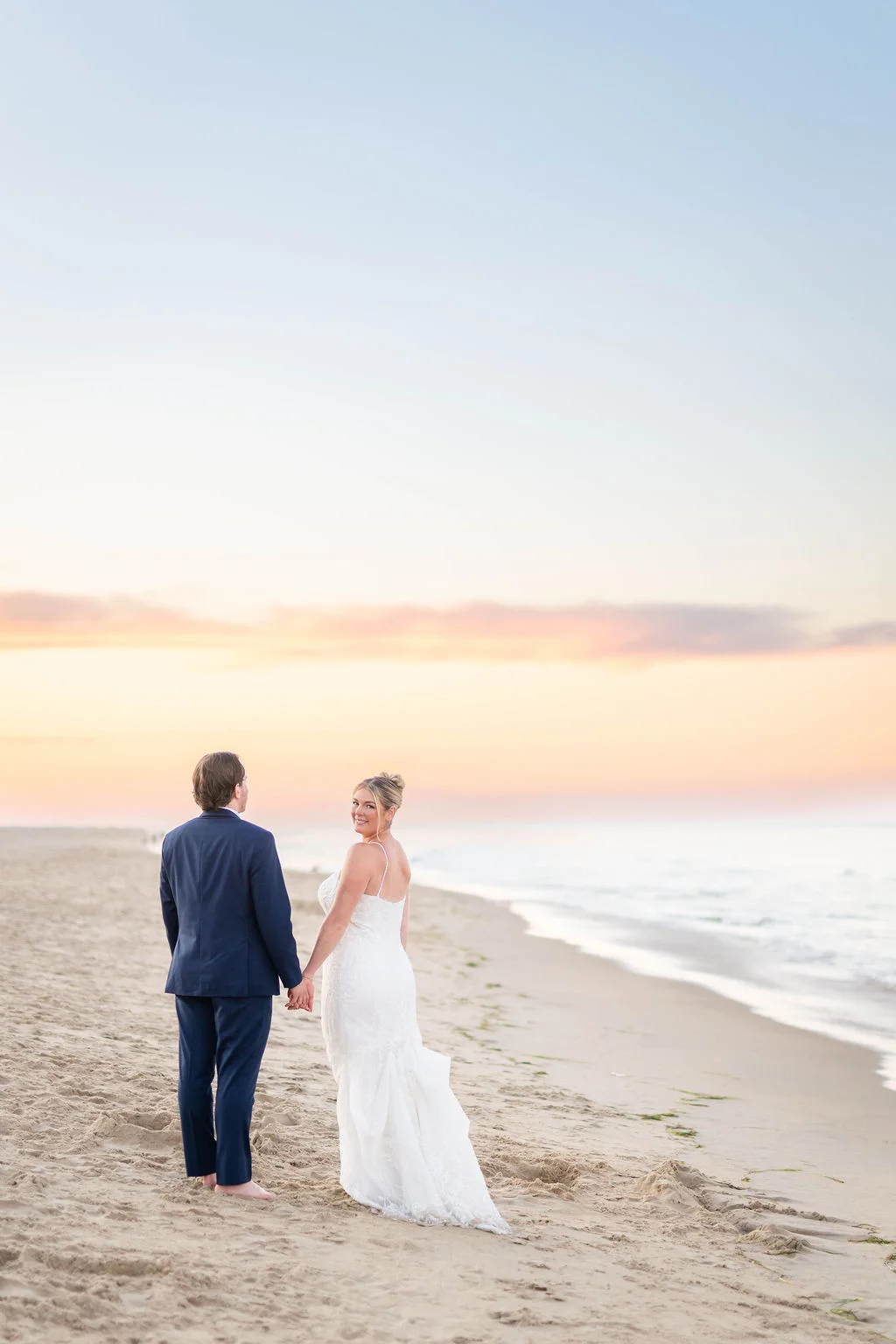 Bride and groom on the beach in Virginia Beach for wedding photos