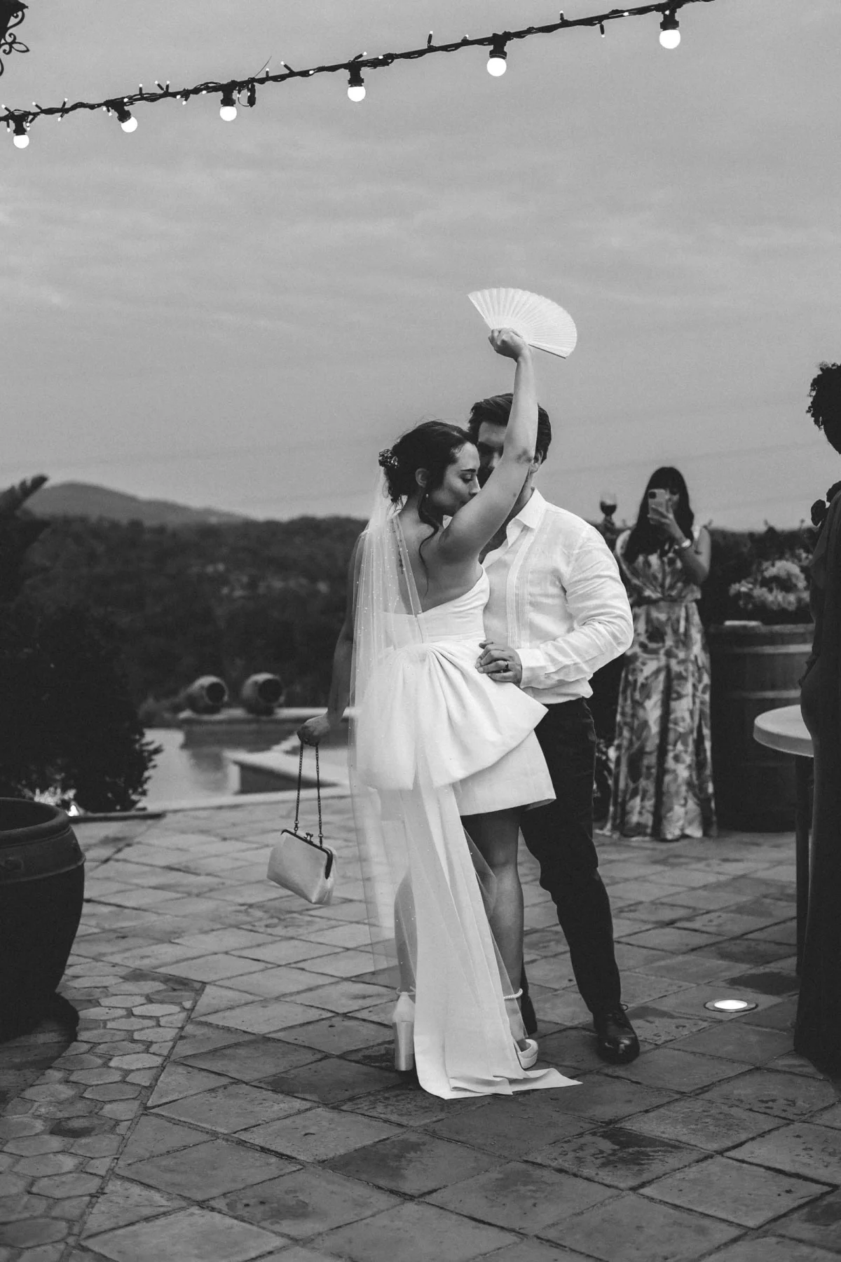 White mini wedding dress with giant floor-length back bow