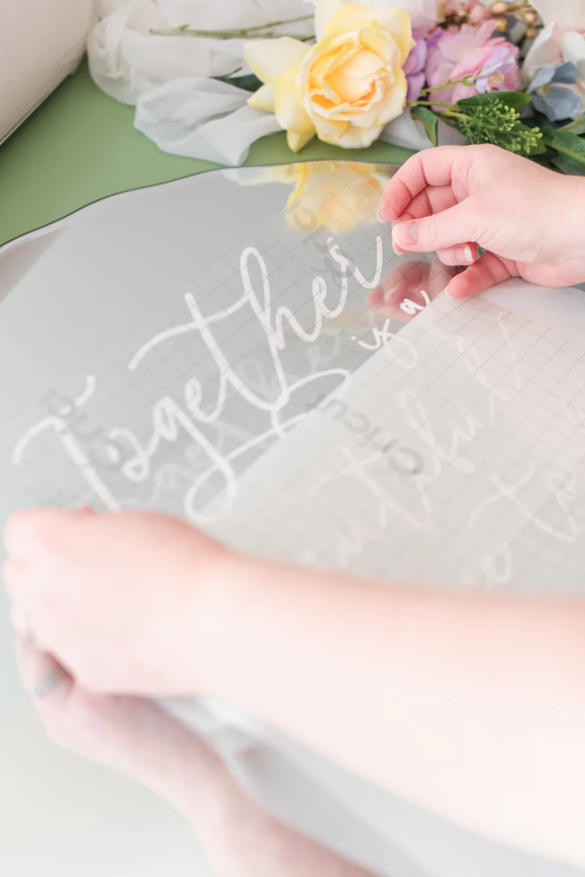 Step by step tutorial on how to transform a mirror into a wedding welcome sign with a Cricut machine from the Cricut Weddings book by Chelsea Barton