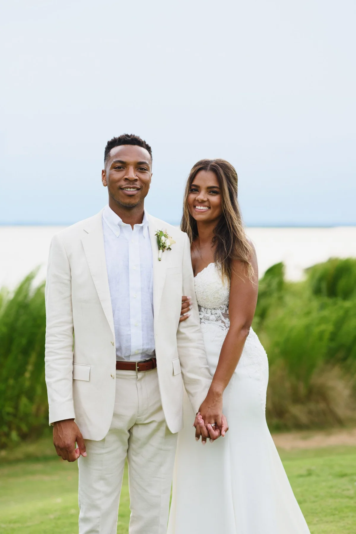 Sunset coral monochromatic bridal look on medium brown skin