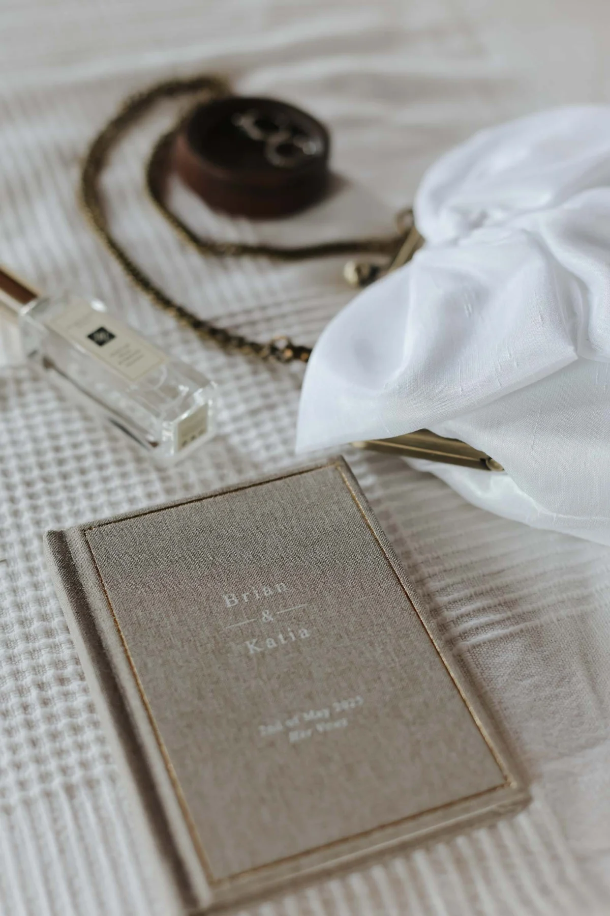 A customized linen vow book for a bride and groom
