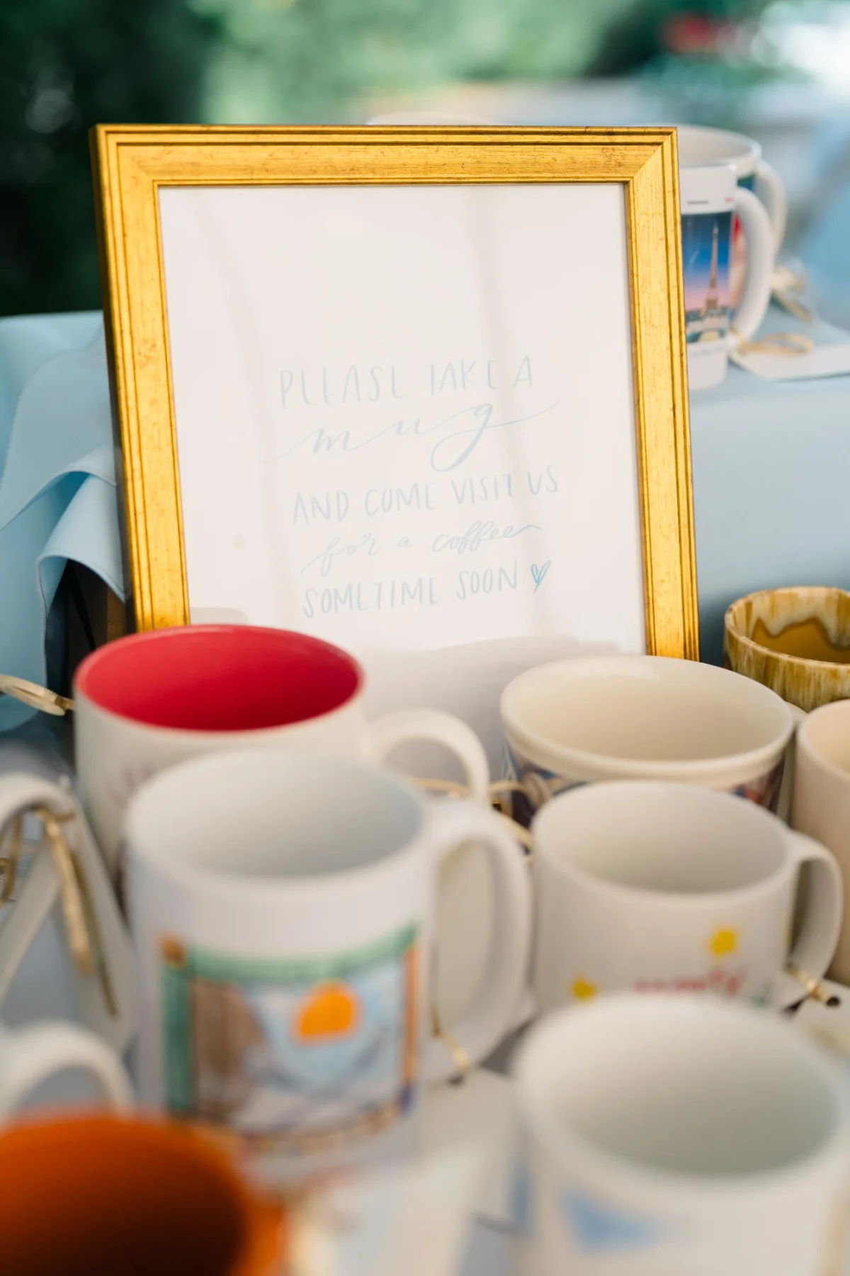 Outdoor thrifted wedding mug favors and frames