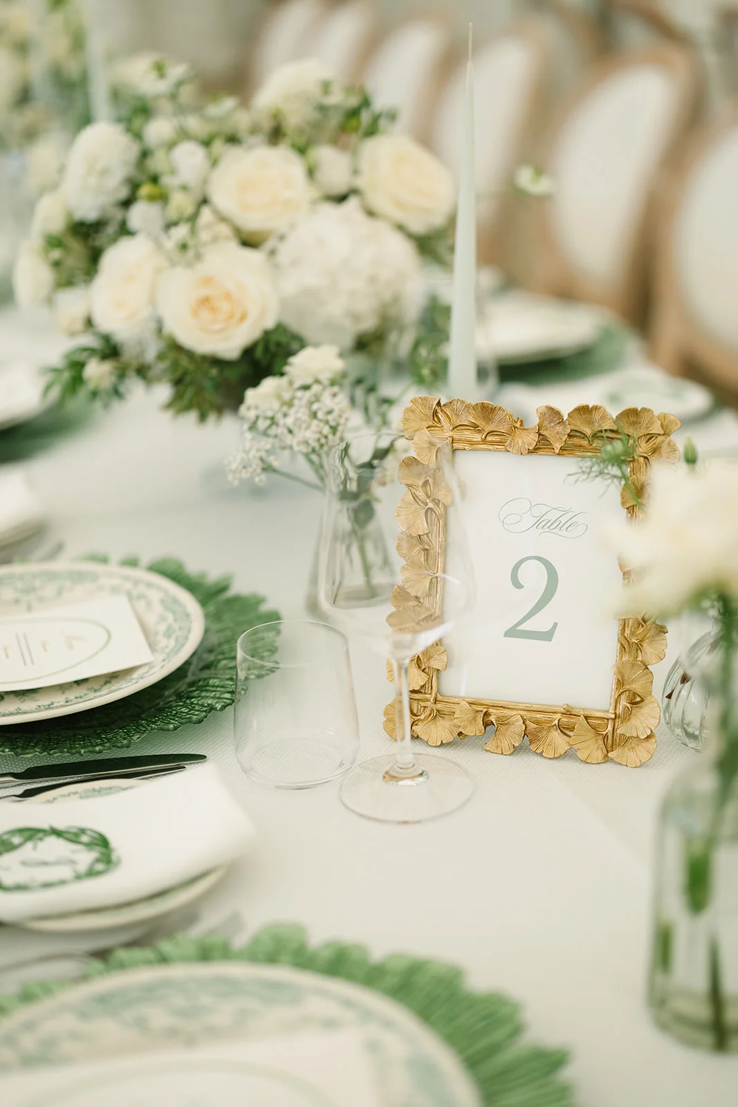 Thrifted picture frames used as wedding table numbers and signage