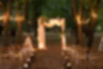 Romantic wedding table with candlelight votives and glowing centerpiece creating an expensive-looking atmosphere on a tight budget