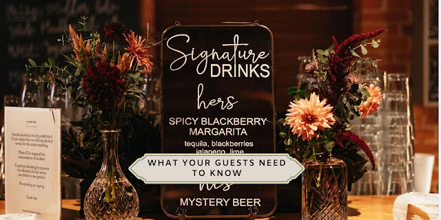Wedding bar details guests need to know Wedding signature-drinks sign framed with burgundy and peach florals at a reception bar, with the overlay “What Your Guests Need to Know.”