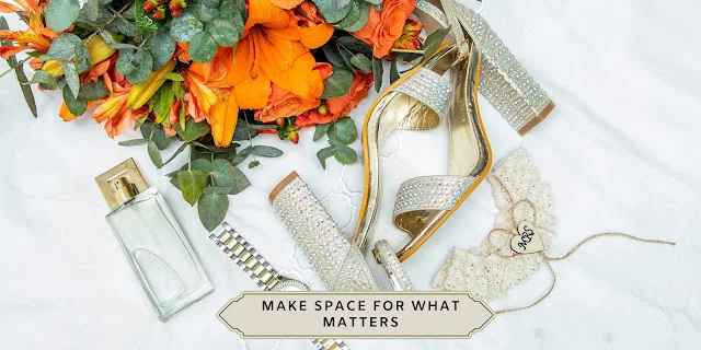 Bridal flatlay: orange roses and lilies, crystal-embellished heels, perfume bottle and garter — front-load wedding planning guide for busy seasons-wedding planning- Weddings by KMich- Philadelphia PA