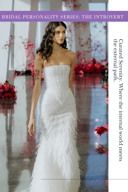 A strapless white column wedding gown by WONÁ Concept featuring a structured corset bodice with a deep basque waist and a skirt covered entirely in delicate white ostrich feathers.